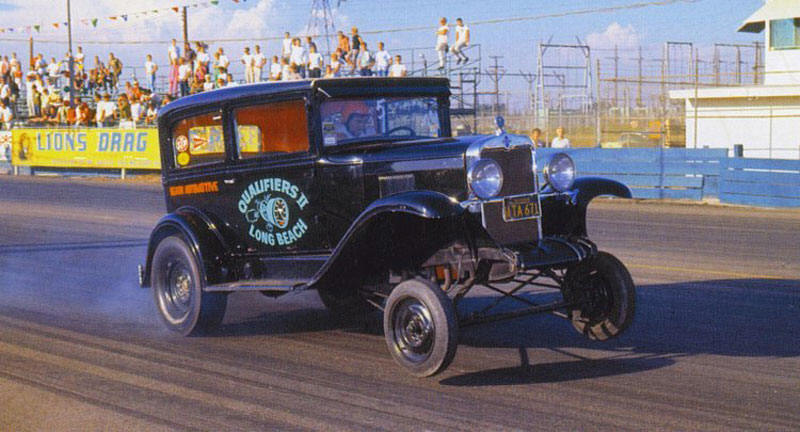 Illustration for article titled Whitewall Tires And Muffler Pipe Rollbars: Drag Racing Back In The Day